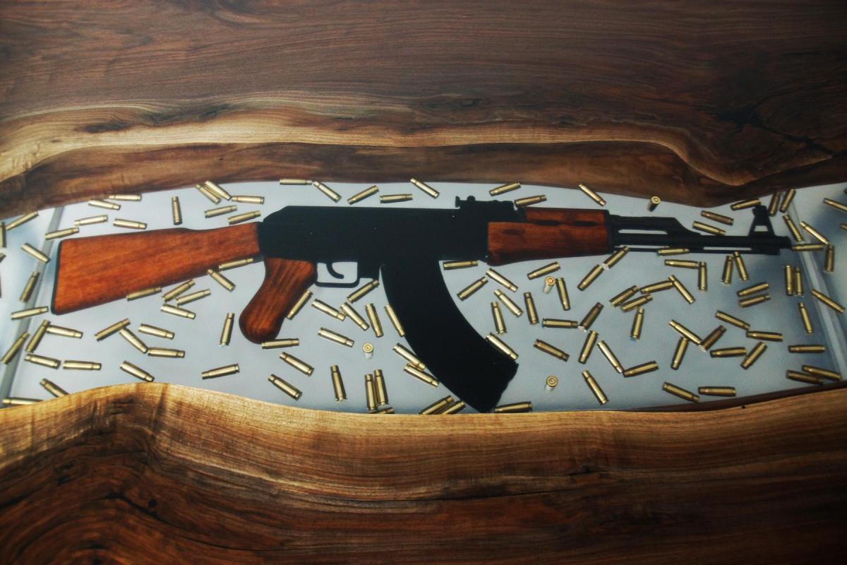 Name:  conference-resin-river-table-with-embedded-firearm-and-bullets-8.jpg
Views: 172
Size:  136.2 KB